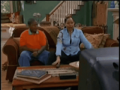 Couple On Couch With Woman Dancing GIF