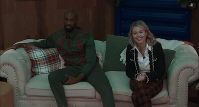 Couple Sitting On Couch With Plaid Pillows GIF