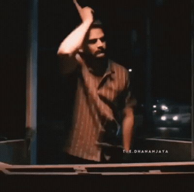 Couple Standing Next To Each Other In Room GIF