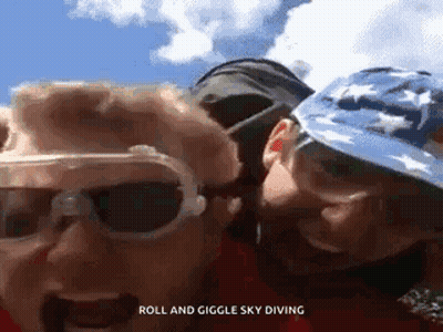 Couple Standing Roll And Giggle Sky Diving GIF