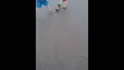Couple Walking Down Street In Rain GIF
