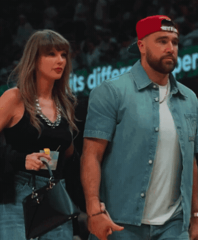 Couple Walking Past Sign Saying Its Different GIF