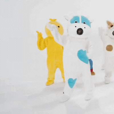 Cow And Dog Stuffed Animals In Line GIF