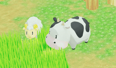 Cow With Black Spots And Sheep Standing In Grass GIF