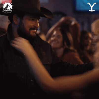 Cowboy Hat Man Dancing With Woman In Paramount Ad GIF