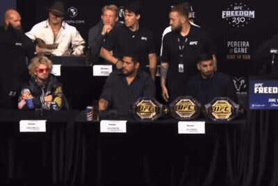 Cowboy Hat Man In Front Of UFC Fighter GIF