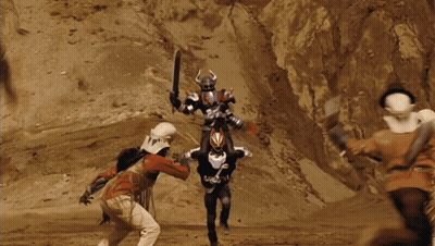Cowboy Hat Man Next To Robot Suit Man GIF