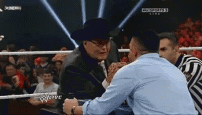 Cowboy Hat Man Shaking Hands In Wrestling Ring GIF