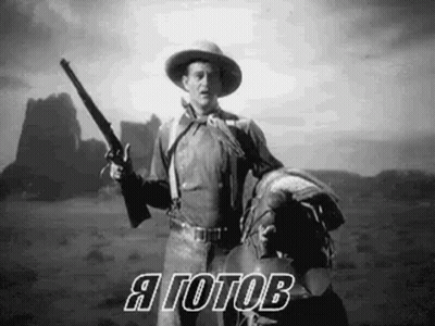 Cowboy Holding Gun On Horse In Desert GIF