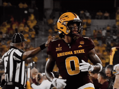 Cowboy Mascot Holding Gun In Front Of Allstate Banner GIF