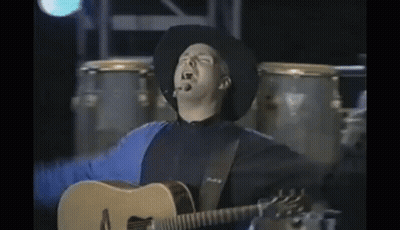 Cowboy Playing Acoustic Guitar Arms Outstretched GIF