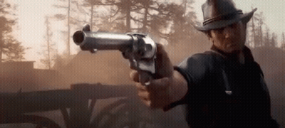 Cowboy Pointing Gun At Horse Drawn Carriage GIF