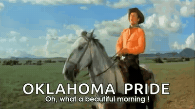 Cowboy Riding White Horse With Oklahoma Pride GIF