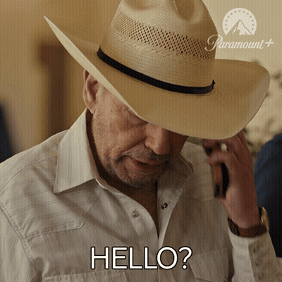 Cowboy Talking On Cell Phone Saying Hello GIF