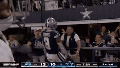 Cowboys Player Cooks Running Towards Fans GIF