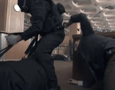 Crawling Man With Man In Black Suit GIF