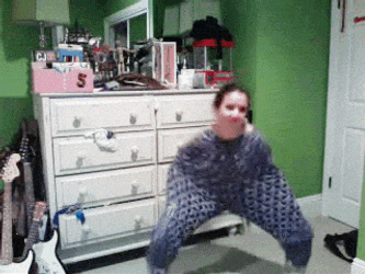 Crazy Dancing Woman Wearing Pajama Until Her Shoulders GIF