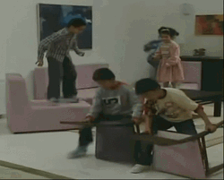 Crazy Kids Carrying Seats While Walking GIF