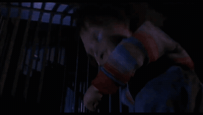 Creepy Doll In Crib With Blue Light GIF