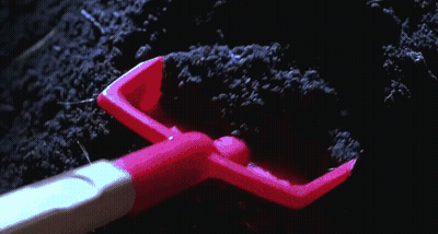 Creepy Doll With Blue Eyes Looking Out Hole GIF