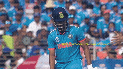 Cricket Player In Blue India Jersey In Front Of Crowd GIF
