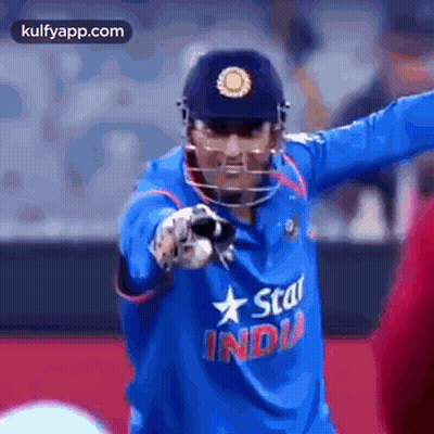 Cricket Player In Helmet And Blue India Shirt GIF