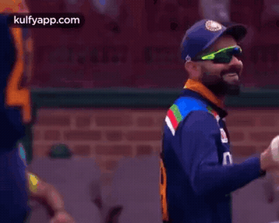 Cricket Player In Sunglasses And Blue Hat GIF