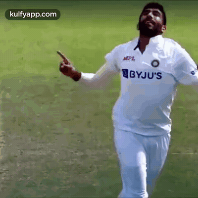 Cricket Player In White Shirt Saying Bbyju's Pointing At Camera GIF