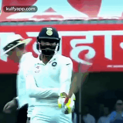 Cricket Player Wearing Helmet And Mask GIF
