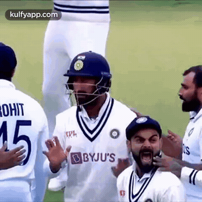 Cricket Players On Field One Wearing Helmet GIF