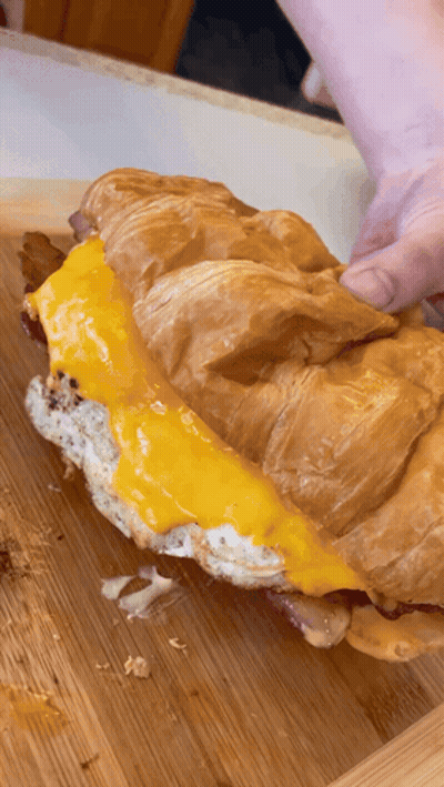 Croissant Sandwich With Cheese And Bacon GIF