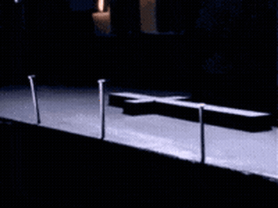 Cross On A Table In The Dark GIF