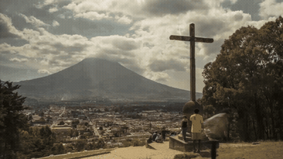 Cross With Mountain Surrounded by Trees