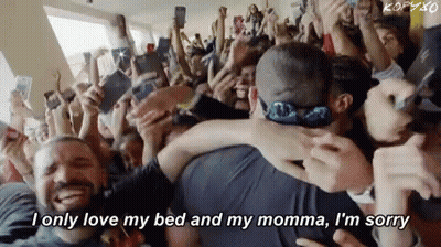 Crowd Around Man And Woman Hugging GIF