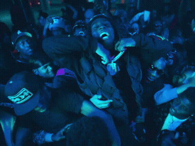 Crowd Around Man In Black Hoodie GIF