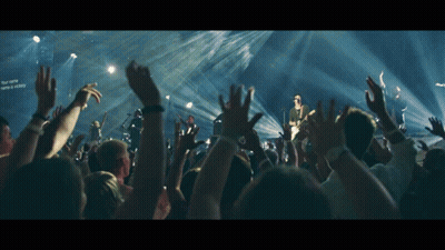 Crowd At Concert With Victory Sign GIF