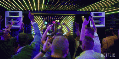 Crowd Dancing At Party With Netflix Logo GIF