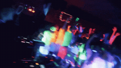 Crowd Dancing In Dark Room With Glow Lights GIF