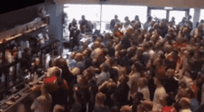 Crowd Gathered In Front Of Bar GIF