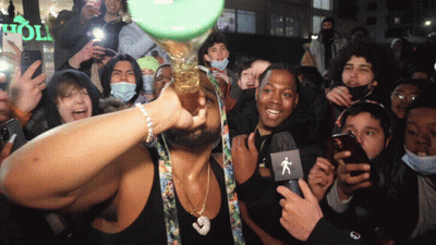 Crowd Gathered In Front Of Holl Store GIF