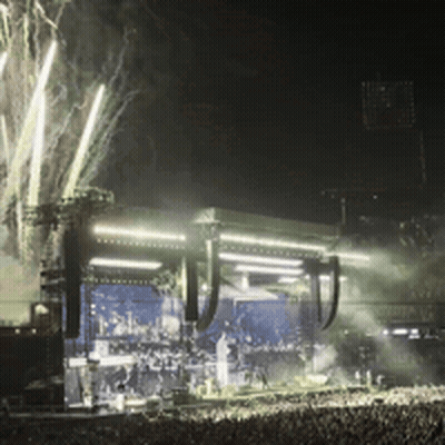 Crowd Gathered In Front Of Stage At Night GIF