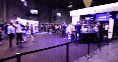 Crowd Gathered In Room With Purple Light GIF