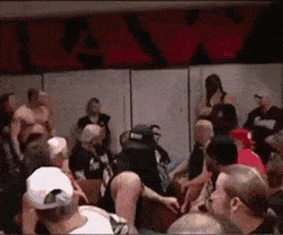 Crowd Gathered In Room With R&A Sign GIF