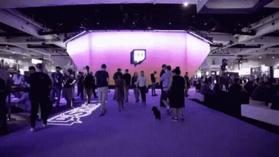 Crowd Gathered In Room With Twitch Logo GIF