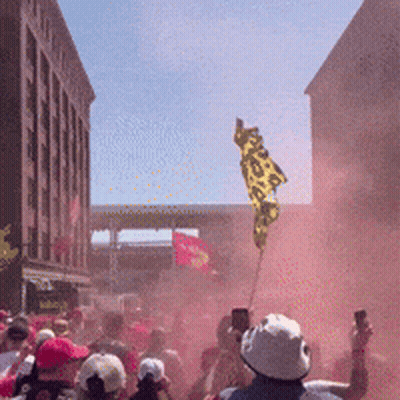 Crowd Holding Freedom Flag GIF