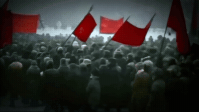 Crowd Holding Red Flags Including Freedom GIF