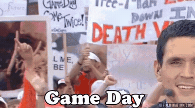 Crowd Holding Signs Saying Game Day GIF