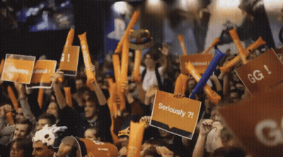 Crowd Holding Signs Saying Seriously GIF