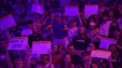 Crowd Holding Signs Saying What A Save And My Oil GIF