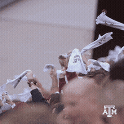 Crowd Holding White Shirts With ATM GIF